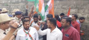 Congress workers protest against ACB raids outside MLA Zameer Ahmed Khan's residence in Bengaluru on Tuesday. 