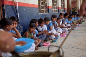 Representative image of students having mid-day meal in school
