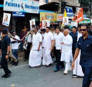 Justice (Retd) BG Kolse Patil walking and in hand with Rahul Gandhi on Monday at Thiruvananthapuram. (Supplied)