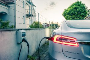 Tesla electric vehicle gets charged