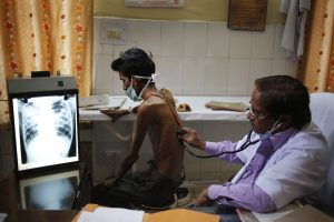 Doctor examining a TB patient