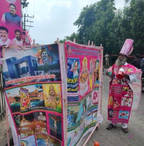 Manohar and his cart wrapped with the sash and banner, respectively.