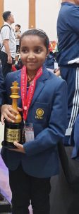 Charvi Anilkumar with the Asian Youth Chess Championship trophy. (Supplied)
