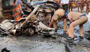 Police personnel at the scene of the blast in Coimbatore.
